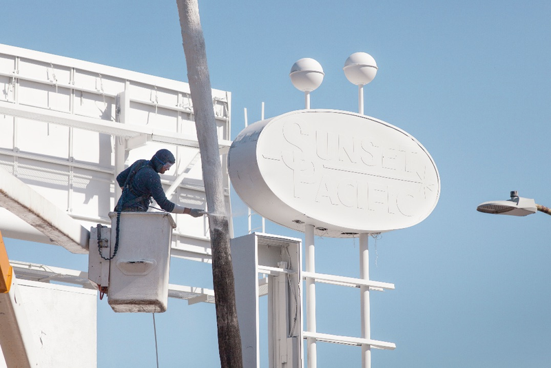 Illustration for article titled Why an Artist Totally Whitewashed This LA Motel—Palm Trees and All
